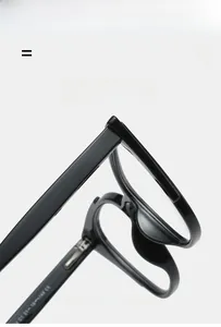 Detail of black cat-eye eyeglass frame hinge and inner temple specification marking