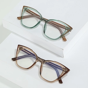 Blue light blocking cat-eye glasses frames in translucent green and brown acetate colors