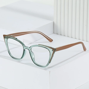 Fashionable cat-eye glasses frame with blue-green rims and brown temples on a modern stand