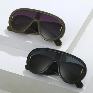 Futuristic punk oversized shield sunglasses in olive green and obsidian black with gold accents