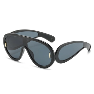 Futuristic punk sunglasses with black oversized frame and blue-grey lenses for outdoors