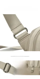 Detail of adjustable oxford fabric strap with premium metal D-rings and smooth zipper