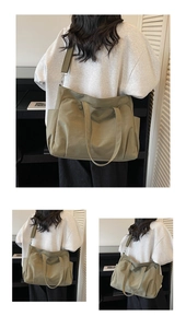 Detail of olive green thick oxford tote bag showing side pocket and adjustable straps