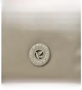 Detailed macro view of the KAISIQI logo on premium khaki Oxford cloth fabric