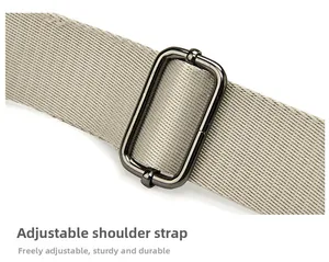Detail of adjustable nylon strap with high-quality polished metal buckle for shell bag