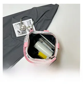 Interior view showing large capacity of the pink floral tote bag with daily essentials