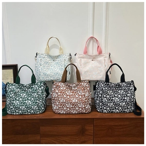Floral print canvas tote bags with multiple pockets and shoulder straps in five colors