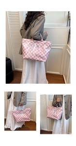 Detail of pink checkerboard tote bag showing glossy texture and white text logo print