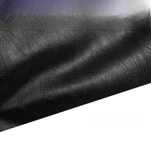 Macro shot of high-quality black lychee pattern leather material on a large tote bag