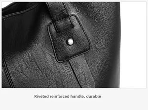Close-up of rivet reinforcement on high-capacity black leather tote bag handle