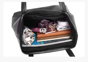 Top view of large black leather tote bag with ample interior storage for daily essentials