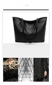 Detail of the high-quality black woven texture and double handles on this large tote bag