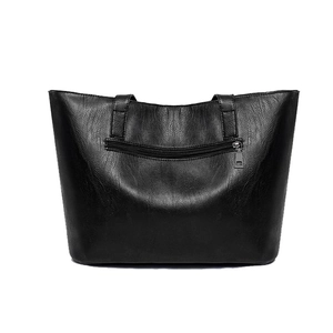 Black leather tote bag with large capacity featuring a convenient back zipper pocket