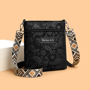Retro black paisley crossbody bag with ethnic woven strap and Perfect Lily leather patch