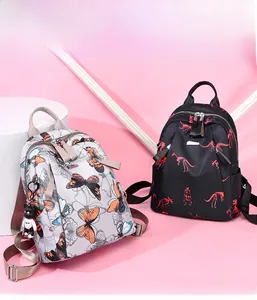 Detail of lightweight floral and graphic printed waterproof nylon backpacks for travel
