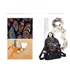 Close-up of lightweight black backpack with feather print, bear charm, and dual zippers
