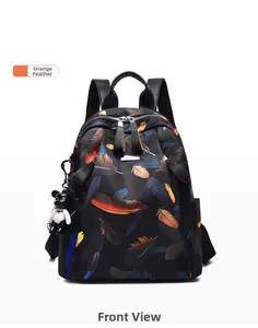 Front view of black waterproof backpack featuring orange feather patterns and bear charm