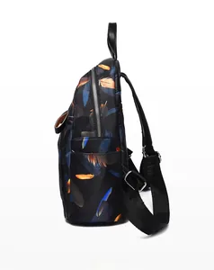 Side view of lightweight printed backpack with colorful feather patterns and silver zippers