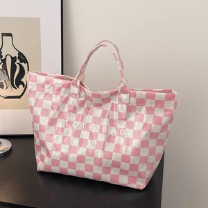 Stylish pink and white checkerboard tote bag with a glossy finish and dual handles