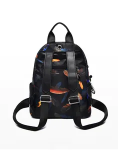 Back view of printed backpack featuring feather patterns and anti-theft zipper pocket