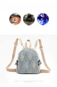 Detail of blue woven mini backpack with geometric patterns, fringe trim and pearl zipper