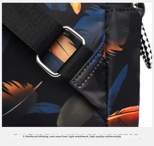 Detail of reinforced stitching and feather print on waterproof nylon travel backpack