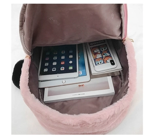 Top view of pink plush backpack showing spacious brown lining and interior capacity