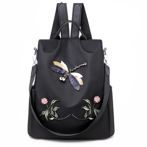 Black Oxford backpack for women with 3D dragonfly embroidery and floral details