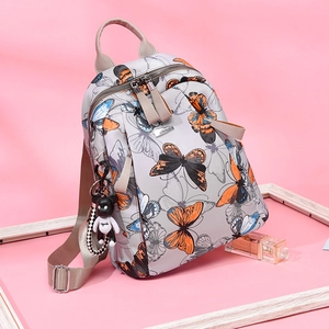 Lightweight grey backpack with butterfly print, dual zippers, and cute panda pendant detail