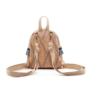 Colorful woven straw mini backpack with bohemian tassels and geometric patterns
