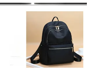 Détail du sac à dos noir en tissu Oxford imperméable avec plusieurs compartiments zippés