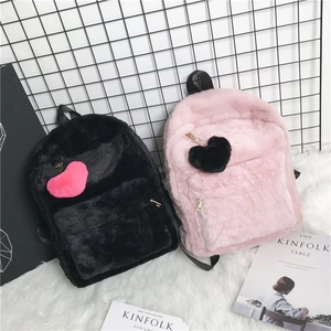 Chic fuzzy plush backpacks in black and pink with heart charms for women and students