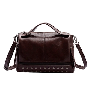 Brown vintage leather Boston bag with metallic rivet base and detachable shoulder strap