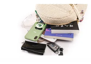 Interior view of beige straw woven backpack showing capacity for phone, water, and keys