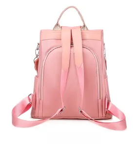Zaino rosa impermeabile con tasca posteriore antifurto e spallacci in nylon