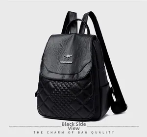 Detail of black faux leather backpack with diamond quilting and gold kangaroo logo