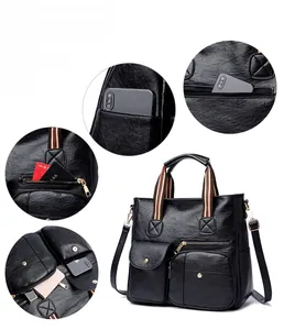 Detail view of large PU leather tote bag with multi-pocket design and striped woven handles
