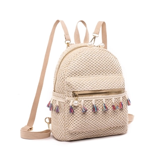 Summer straw woven backpack for women with colorful fringe details and pearl zipper