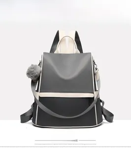 Front view of large capacity waterproof oxford backpack with plush ball accessory