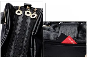 Detail view of triple-layered gold zippers and rear anti-theft pocket on pebbled leather bag