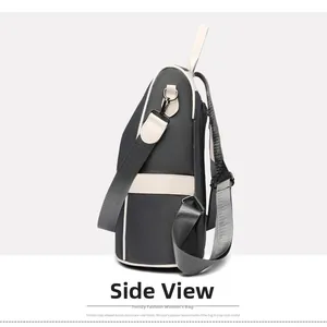 Side view detail of the minimalist oxford fabric backpack with durable metal D-rings