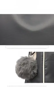 Detailed view of high-density oxford fabric with a decorative grey faux fur pompom charm