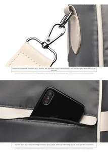 Detail showing detachable silver hooks and front zipper pocket of the gray oxford backpack