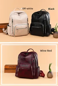 Detail view of large capacity faux leather backpacks in white, black, and red colors