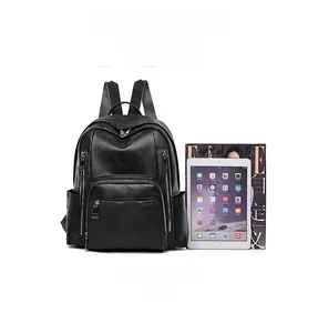 Large black PU leather backpack showing capacity fit for A4 magazines and iPad