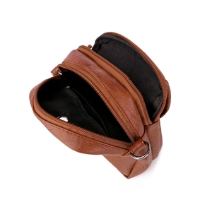 Brown faux leather crossbody bag with multiple zipper compartments and internal pockets