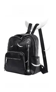 Detail of black leather backpack with patchwork design and pressure-reducing straps