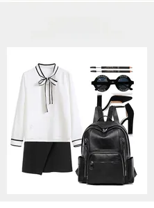 Flat lay of a black pebbled leather backpack with multi-zipper design and stylish outfit