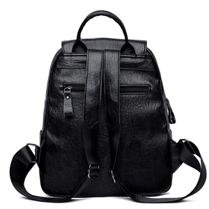 Vintage quilted black faux leather backpack featuring adjustable straps and hidden pocket