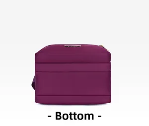 Detailed bottom view of purple nylon crossbody bag showing tiered layered storage structure
